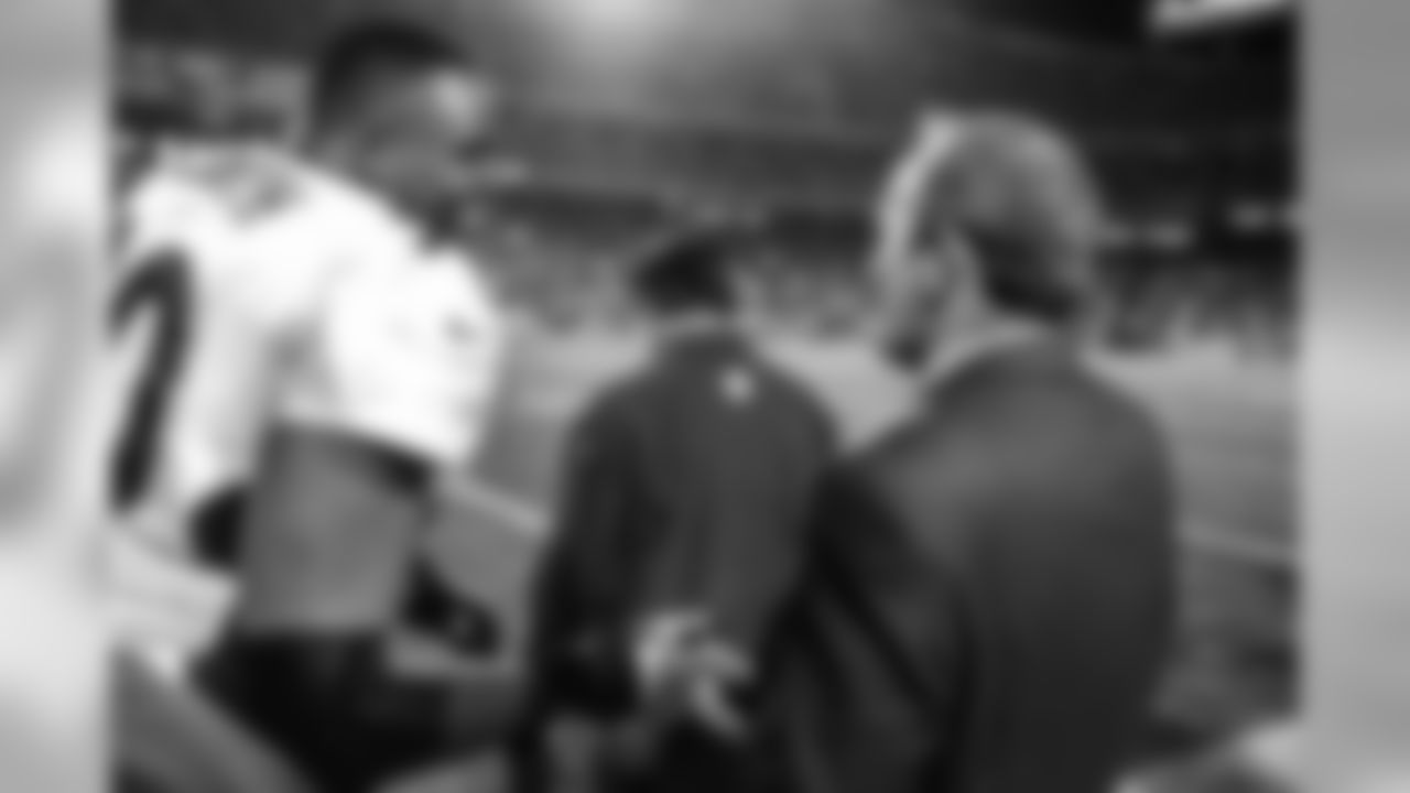 Neil Smith and Pat Bowlen congratulate one another after the Broncos' victory against the Kansas City Chiefs at Arrowhead Stadium in Kansas City, MO on November 16, 1998.