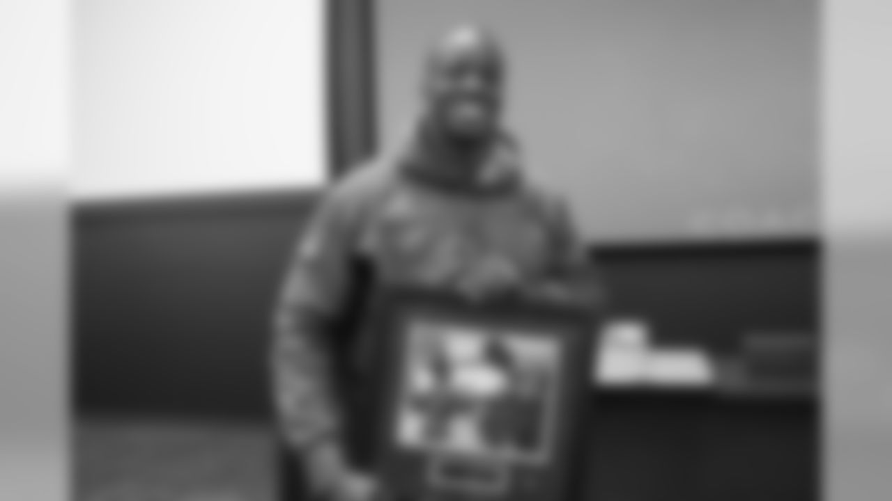Joe Jones is recognized with a Community Ambassador Award at a team meeting where the Denver Broncos Community Development department announced and recognized 2019 community champion award winners on December 12, 2019. (Photo by Ben Swanson)