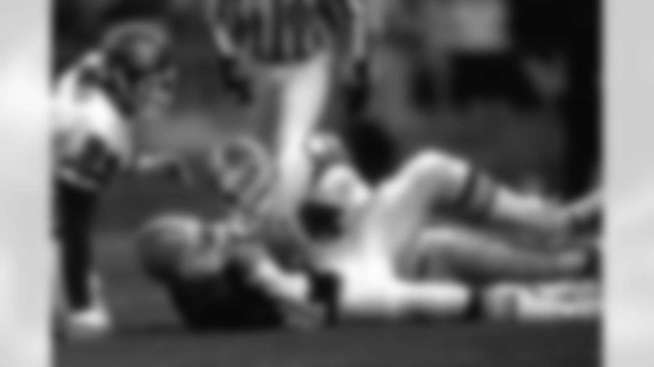 Karl Mecklenburg sacks Browns quarterback Bernie Kosar during the Broncos' 29-14 victory over Cleveland on November 7, 1993.