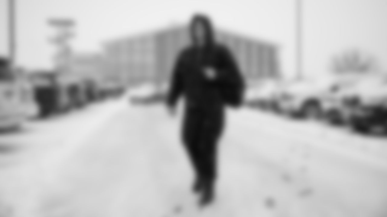 Jake Rodgers walks through UCHealth Training Center as snow continues to fall after a foot accumulated overnight on November 26, 2019. (Photo by Ben Swanson)