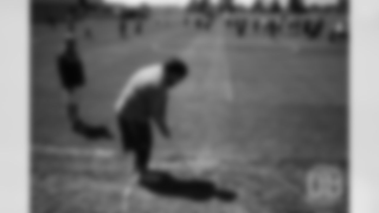 Mike Purcell hits a chip shot during the Broncos field day on June 6, 2019.