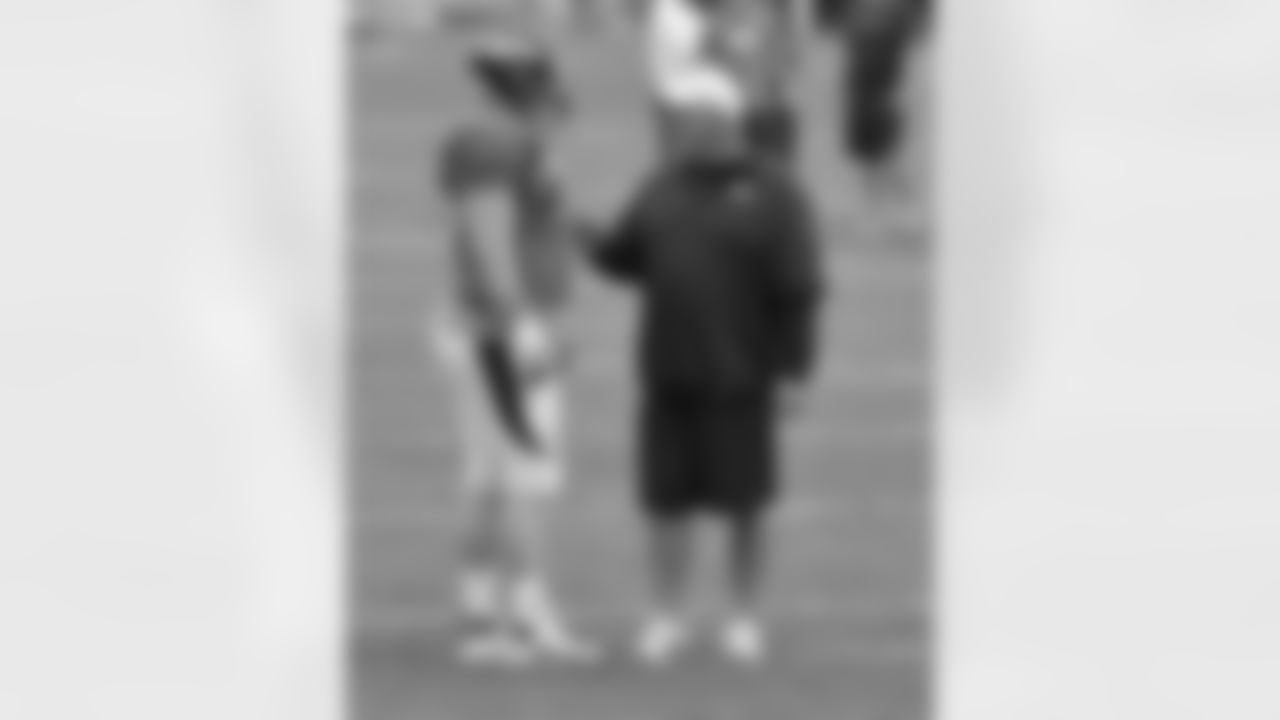 G Chris Kuper talks to OL Coach Dave Magazu.