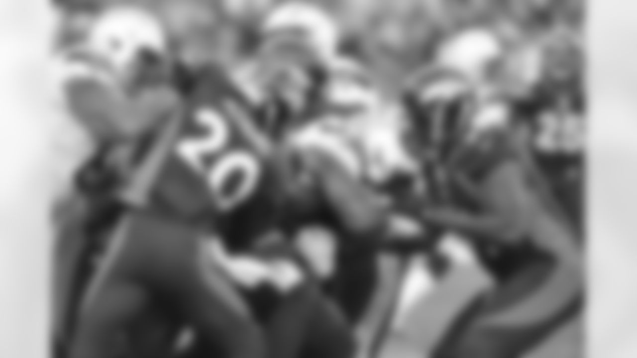 Adams and the Denver defense swarm the football.