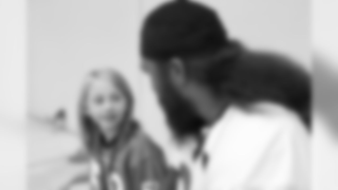 Children's Hospital Colorado junior reporter Kaylea interviews Domata Peko Sr. after practice on September 5, 2018 at UCHealth Training Center.