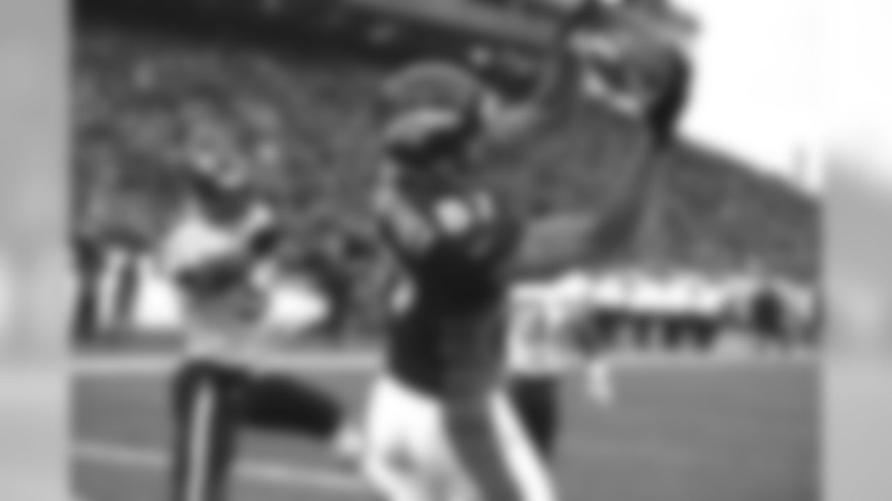 Ed McCaffrey makes a touchdown reception in the back of the end zone against the San Diego Chargers at Mile High Stadium in Denver, CO on November 8, 1998.