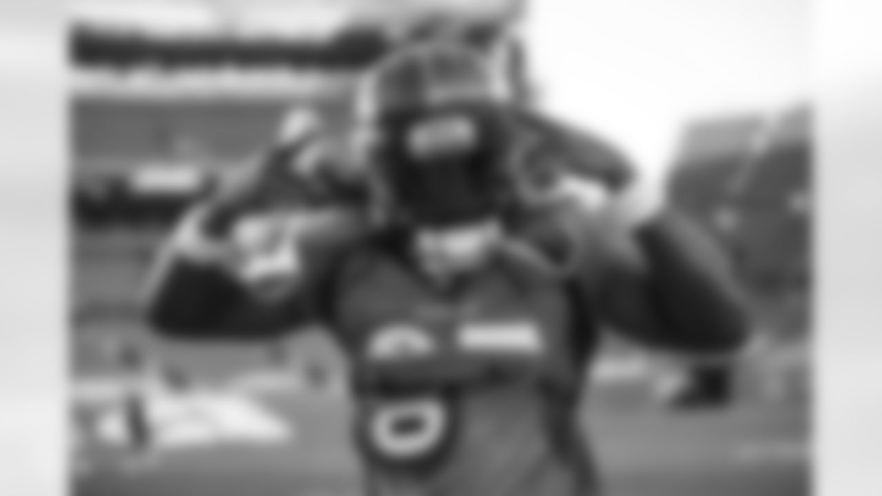 Melvin Gordon III poses for a photo as he runs out before the final training camp practice at Empower Field at Mile High on September 4, 2020. (Photo by Ben Swanson)