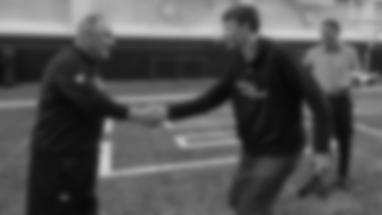 Head Coach Vic Fangio greets former Bronco Jake Plummer at the ninth annual High School Football Coaches Clinic hosted by the Broncos for 190 coaches from 54 different schools on May 8, 2019.
