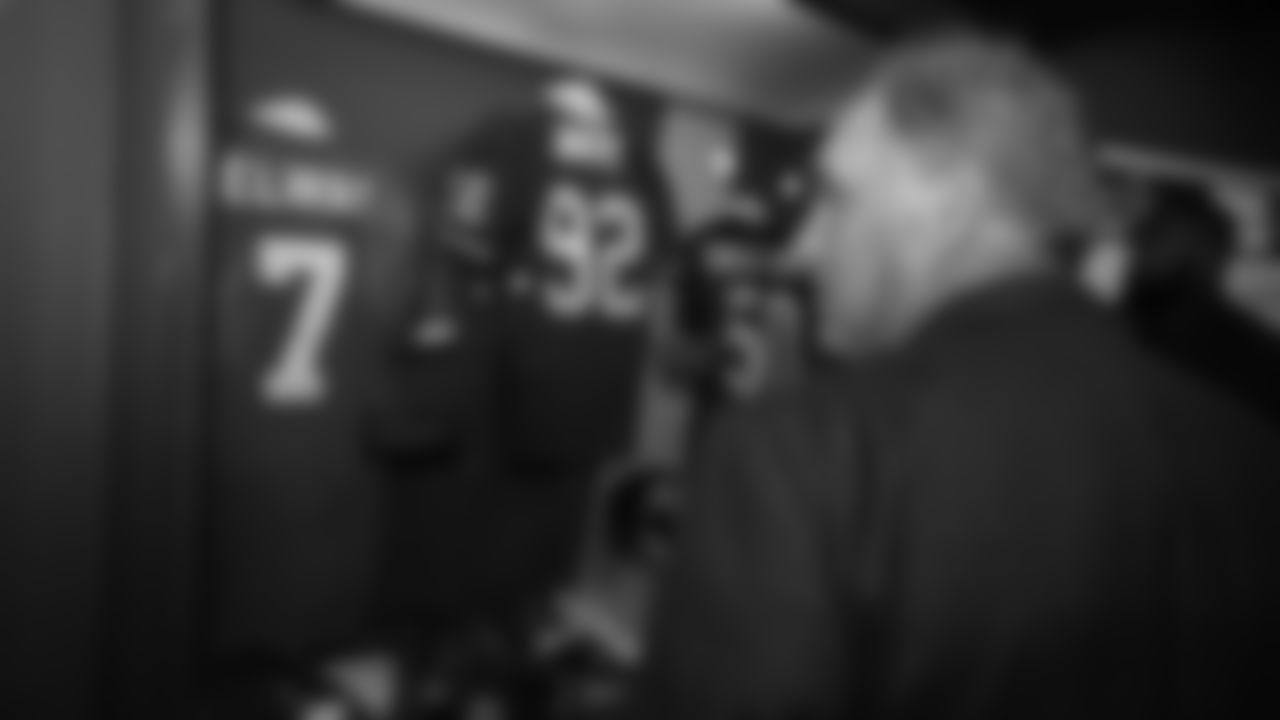 Head Coach Vic Fangio looks at John Elway's jersey during a tour of the Pro Football Hall of Fame in Canton, Ohio, on July 31, 2019.