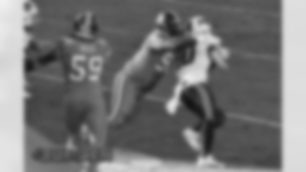 Denver Broncos nose tackle Kyle Peko (90) tackles Buffalo Bills running back Zack Moss (20) during the NFL game against the Buffalo Bills at Empower Field at Mile High in Denver, Colorado, December 19, 2020.
Photo by Eric Bakke