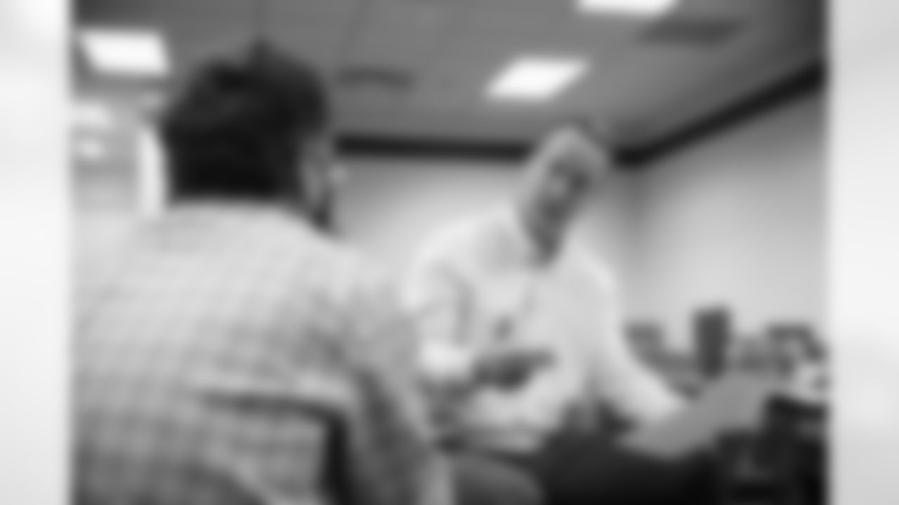 Peyton Manning reviews interview notes and other information with NFL Films Producer Neil Zender before the taping of an episode of Peyton's Places at Empower Field at Mile High on June 26, 2020. (Photo by Ben Swanson)