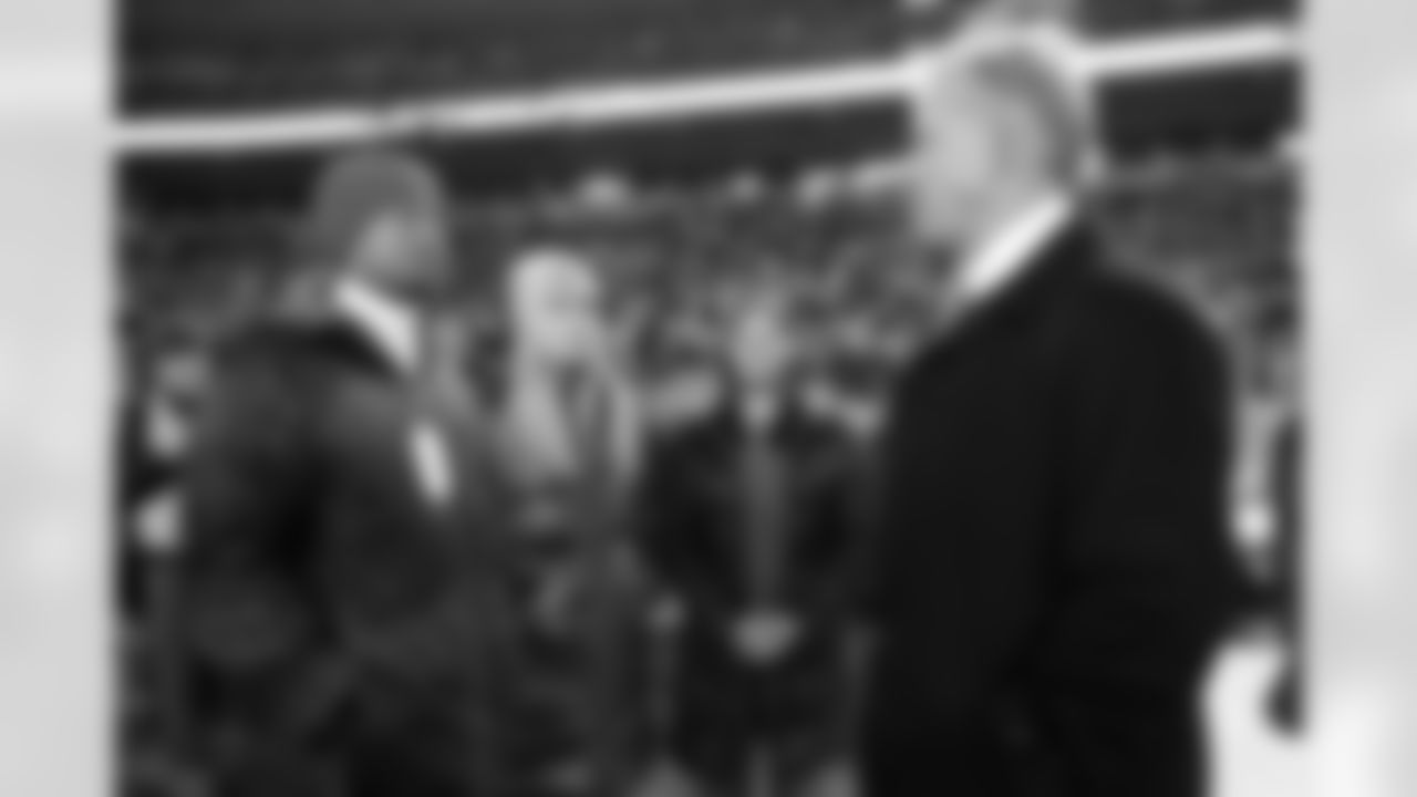 Tiger Woods and Lindsey Vonn visit with John Elway before Denver's Week 11 game vs. Kansas City.