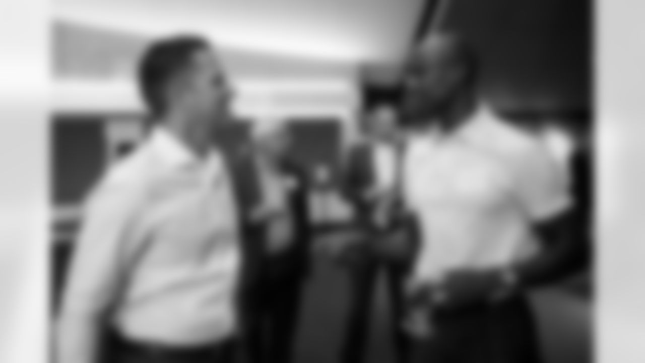 General Manager George Paton speaks with former Bronco Brandon Lloyd and other local business leaders during a visit to Empower Field at Mile High in Denver, Colorado on September 29, 2021. (Photo by Ben Swanson)