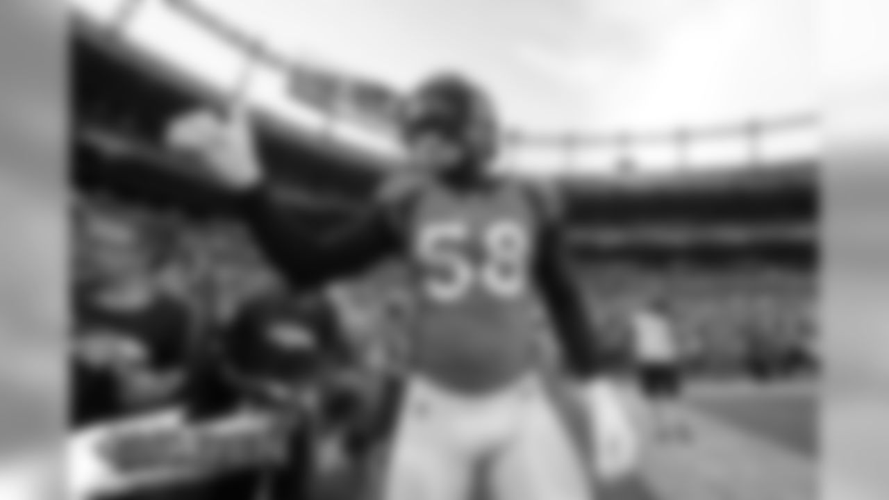 Denver Broncos outside linebacker Von Miller (58) gives a thumbs up tp fans prior to an NFL preseason football game against the Arizona Cardinals, Thursday, Aug. 29, 2019, in Denver. (AP Photo/Jack Dempsey)