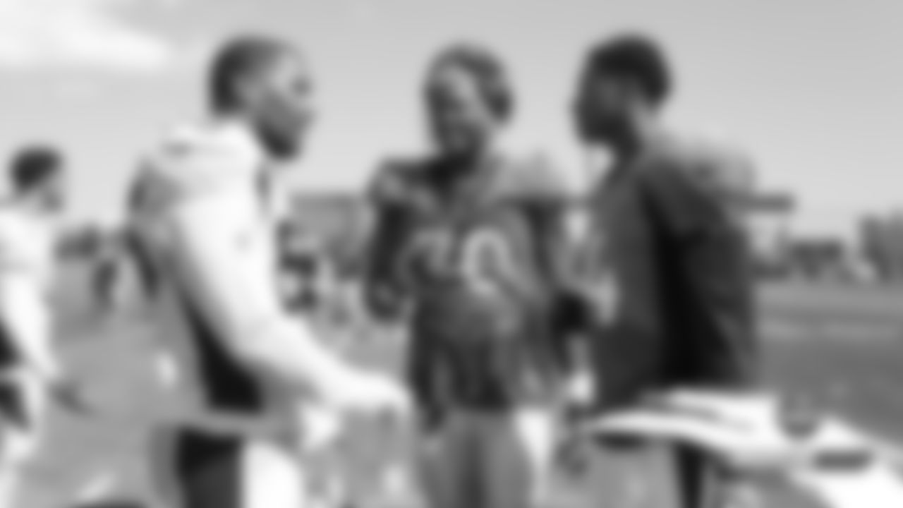 Bradley Chubb talks with Ja'Wuan James and Courtland Sutton at a joint practice with the San Francisco 49ers on the 19th day of training camp on August 16, 2019.
