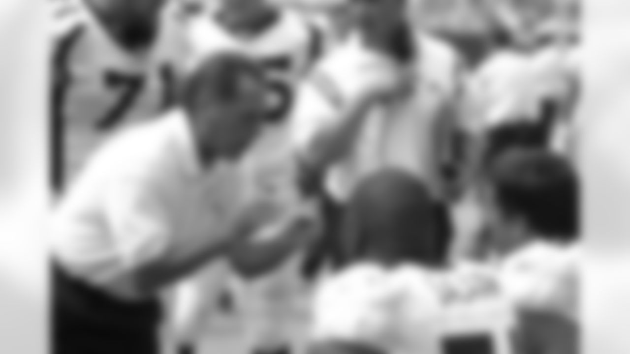 Alex Gibbs talks with his players along the sidelines against the Cincinnati Bengals at Paul Brown Stadium in Cleveland, Ohio on September 7, 2003.