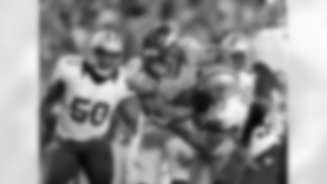Thomas fights for some of his game-high 137 yards.