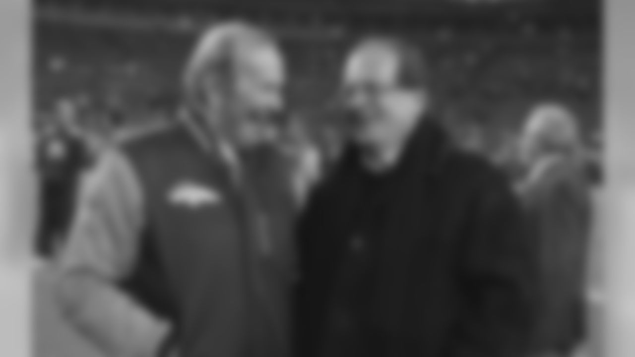Denver Broncos owner Pat Bowlen, left, talks with San Diego Chargers owner Dean Spanos before the start of an NFL football game between their two teams, Thursday, Dec. 12, 2013, in Denver. (AP Photo/Jack Dempsey)