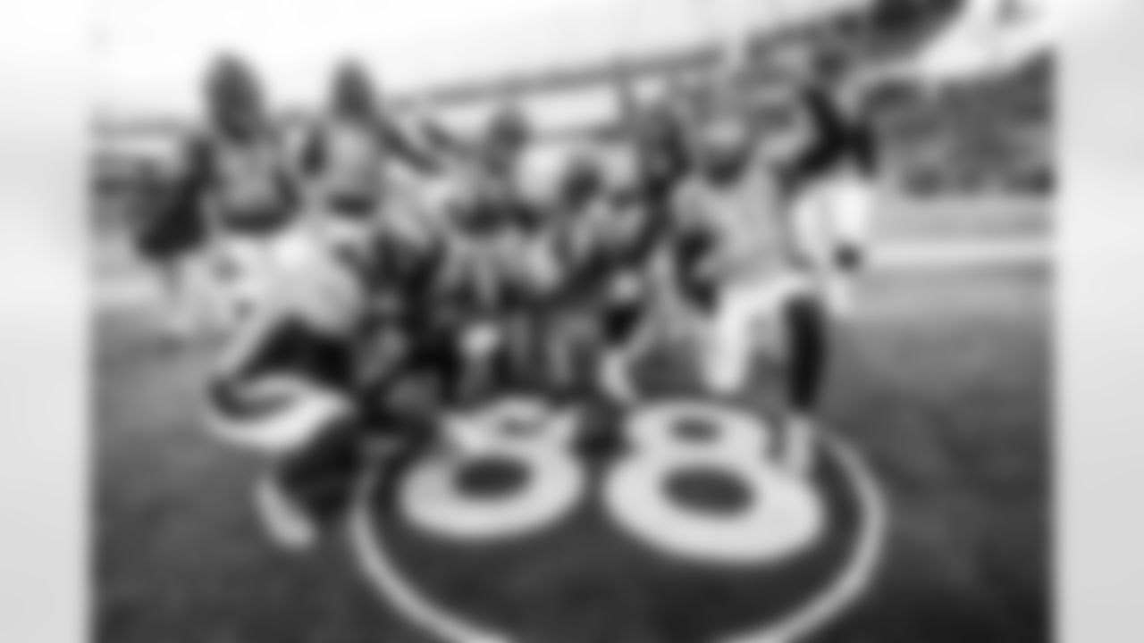 Baron Browning, Pat Surtain II, Jonathon Cooper, Justin Simmons, Caden Sterns, Stephen Weatherly, Ronald Darby, Shamar Stephen, Bradley Chubb, Shelby Harris and the defense celebrates a fumble recovery at Demaryius Thomas's field memorial during the NFL game against the Detroit Lions on Sunday, December 12, 2021 at Empower Field at Mile High in Denver, Colorado.
Photo by Gabriel Christus