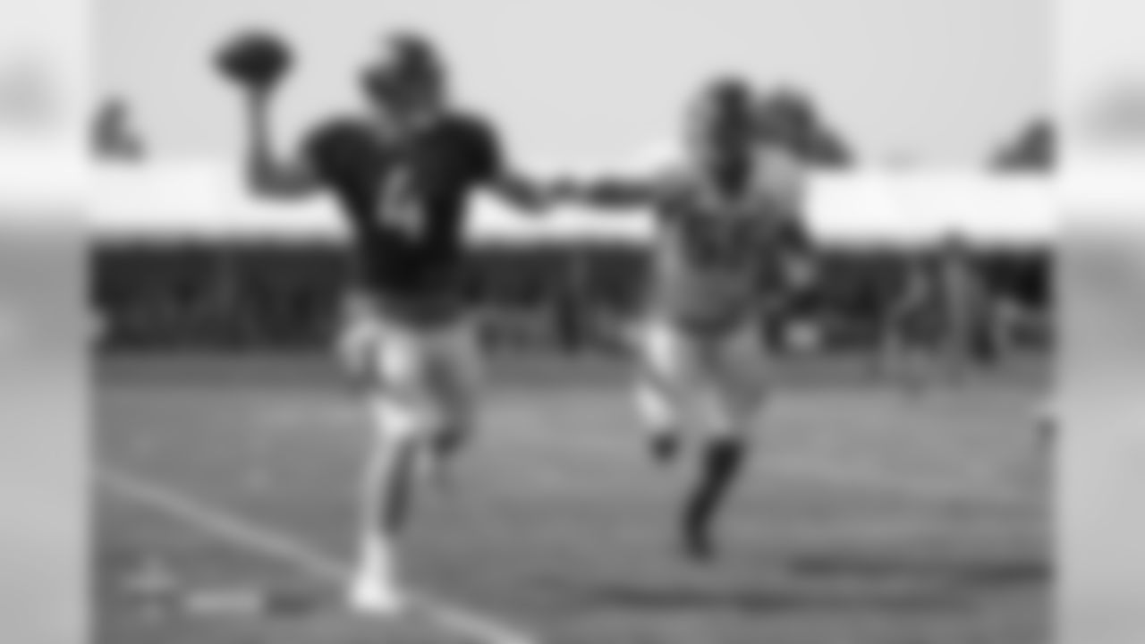 Quarterback Case Keenum (4) and outside linebacker Bradley Chubb (55) during the ninth day of training camp on August 7, 2018, at UCHealth Training Center.