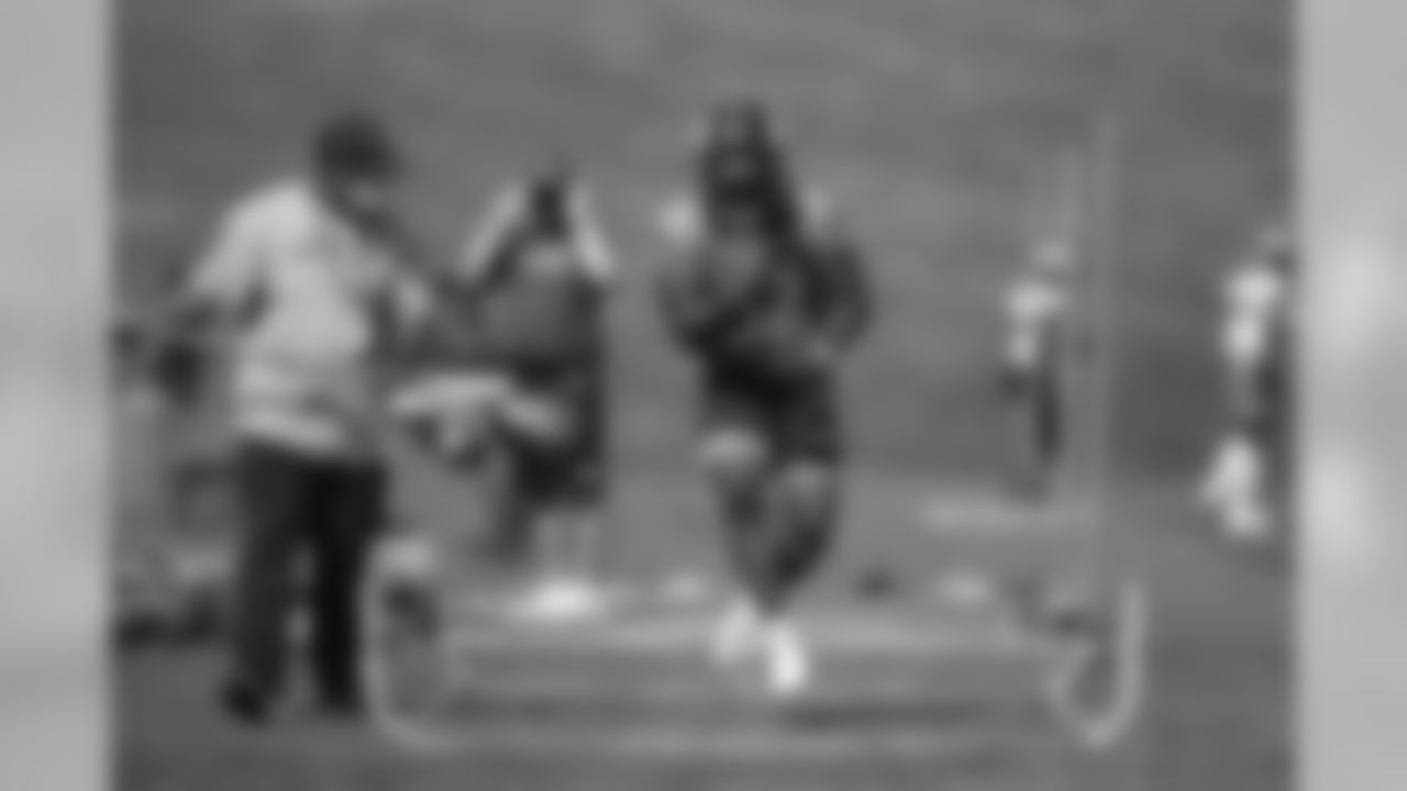 LeVante Bellamy goes through a drill with Running Backs Coach Curtis Modkins during practice for early reports at UCHealth Training Center on August 10, 2020. (Photo by Ben Swanson)