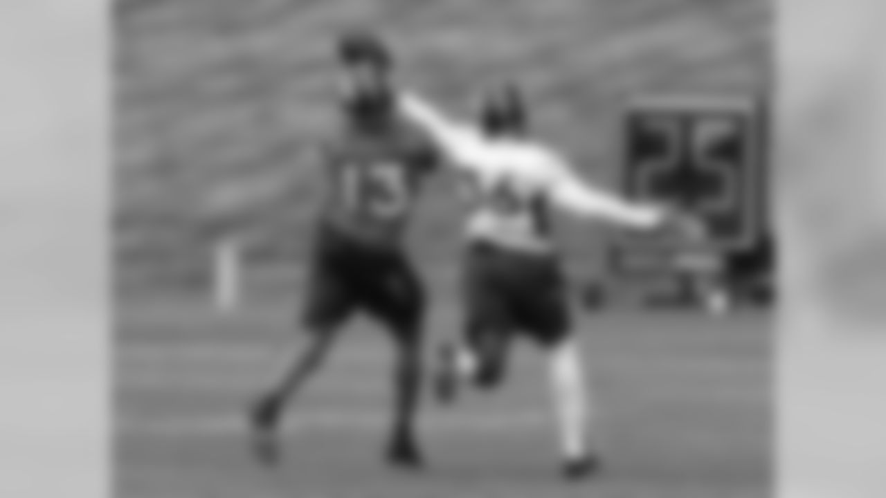 WR Nathan Palmer and CB Kayvon Webster battle for a pass.