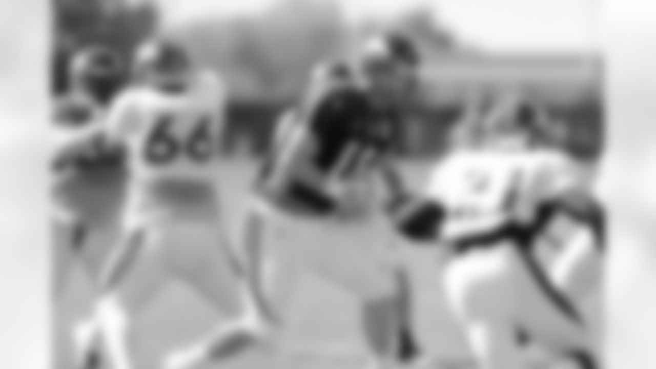 Manning hands to Hillman.