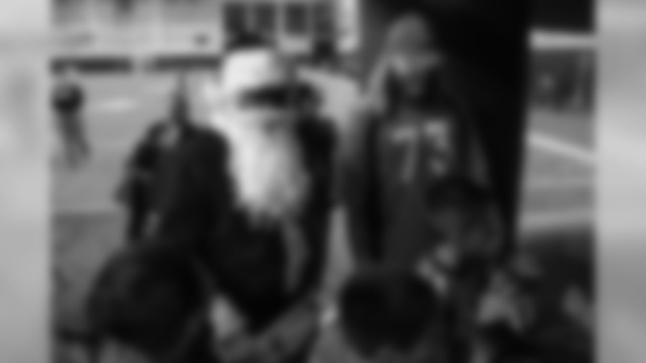 Von Miller, dressed as Santa Claus, and Andreas Knappe at the Broncos' Boys & Girls Club holiday party for about 200 children from the Boys & Girls Clubs of Metro Denver at UCHealth Training Center on December 17, 2018.