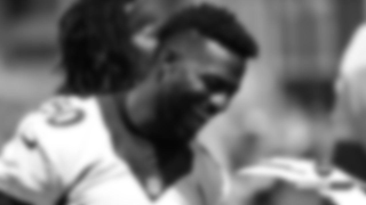 Emmanuel Sanders laughs on the sideline during practice on Day 1 of training camp on July 18, 2019.