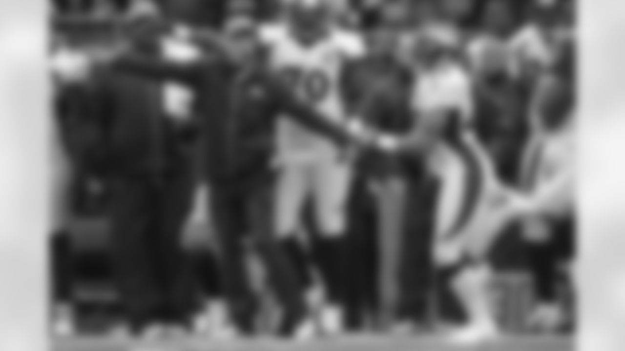 Head Coach John Fox points Harris towards the end zone, where he would end up after a franchise-record, 98-yard interception return for a score.
