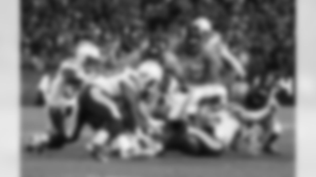 The Denver Broncos go after a loose ball during an onside kick during fourth quarter action against the San Diego Chargers in an AFC divisional playoff NFL game at Sports Authority Field in Denver, CO on January 12, 2014.
Photo by Gabriel Christus