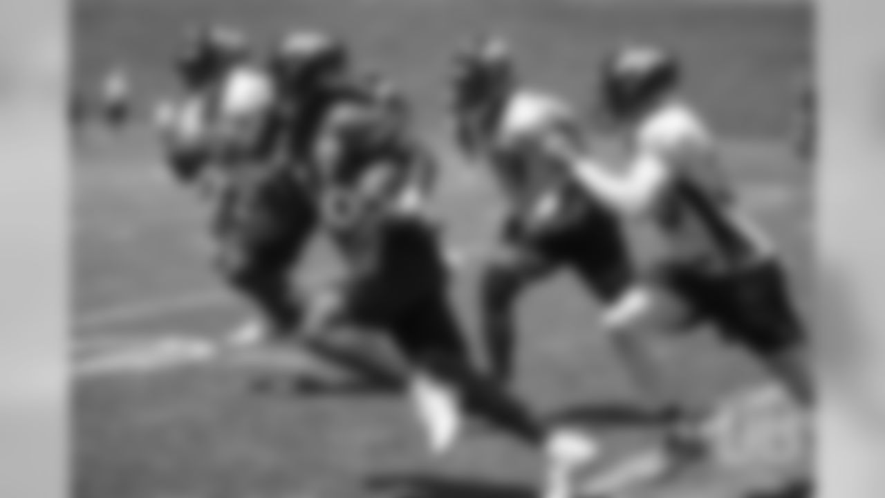 running back David Williams (36) is chased by multiple defenders during practice at the eighth day of OTAs on June 5, 2018.