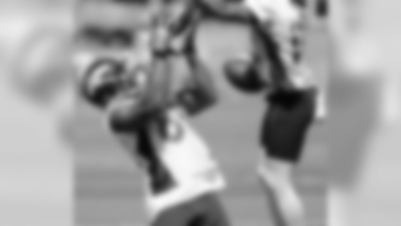 Caldwell tries to defend a pass intended for Thomas.