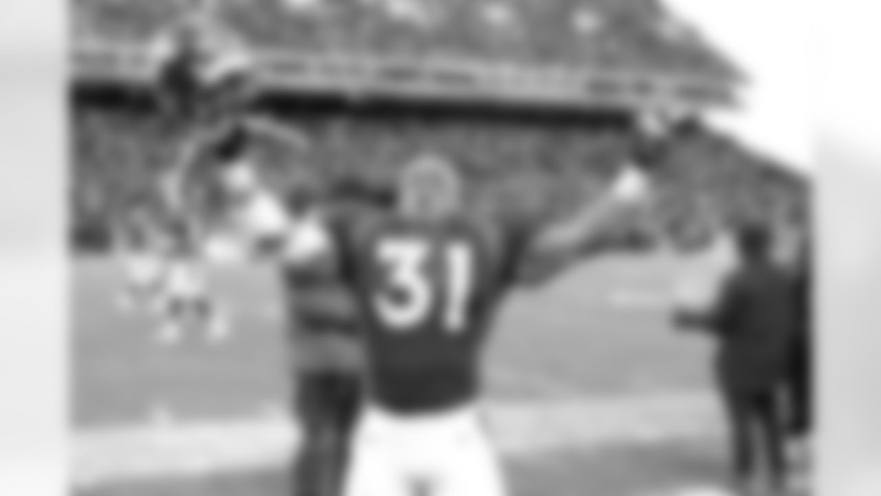 Denver: Derek Loville racked up 103 rushing yards and two touchdowns on just 11 carries and celebrated at the conclusion of the game against the Jacksonville Jaguars at Mile High Stadium in Denver, CO on December 27, 1997.