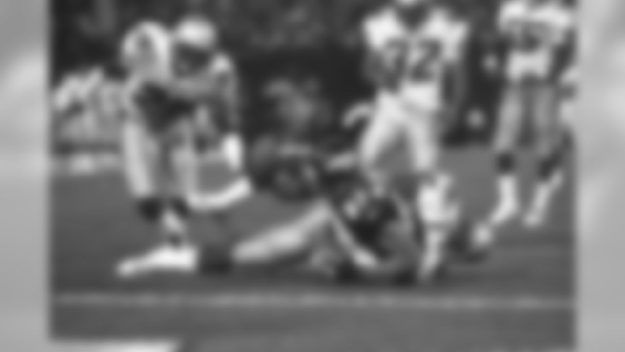Ed McCaffrey tries to stretch the ball across the goal line, but comes up just a yard short against the New England Patriots at Mile High Stadium in Denver, CO on September 7, 1998.