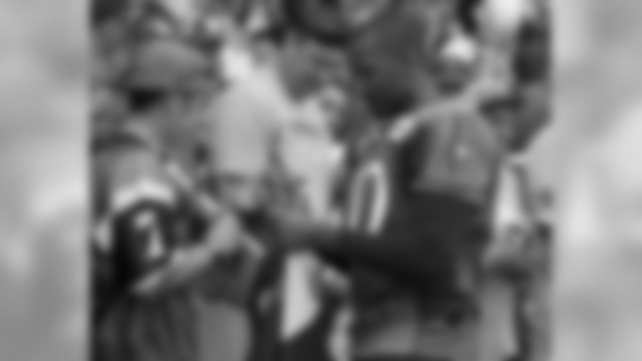 Phillips signs autographs after practice.