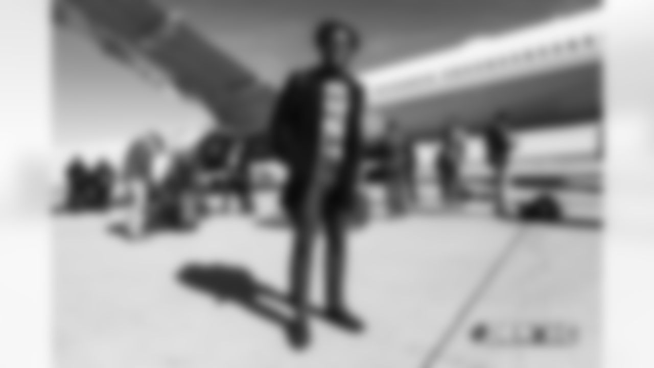 Isaiah McKenzie walks on the tarmac to the plane before the flight during the team's travel for their Week 8 game against the Kansas City Chiefs on October 27, 2018.