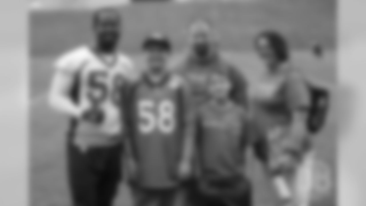 TJ, a 12-year-old fighting cystic fibrosis, wanted to be Von Miller for a day, and the Make-A-Wish Foundation helped make that dream come true on September 29, 2018. Here, Miller and the family take a group photo.
