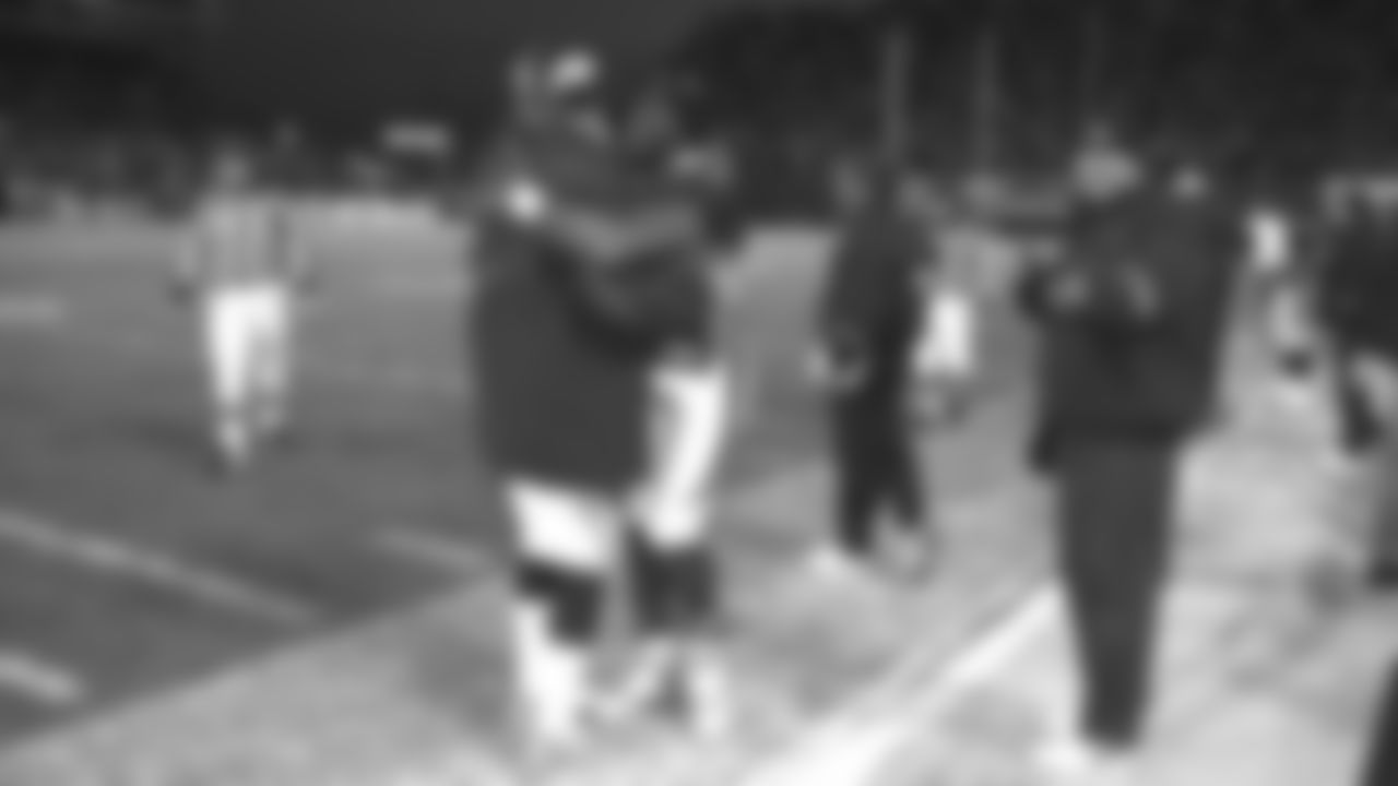 Shannon Sharpe hugs John Elway as the Broncos clinch victory during the Broncos' 42-17 win over the Jacksonville Jaguars in the Wild Card round of the 1997 playoffs on December 27, 1997 at Mile High Stadium.