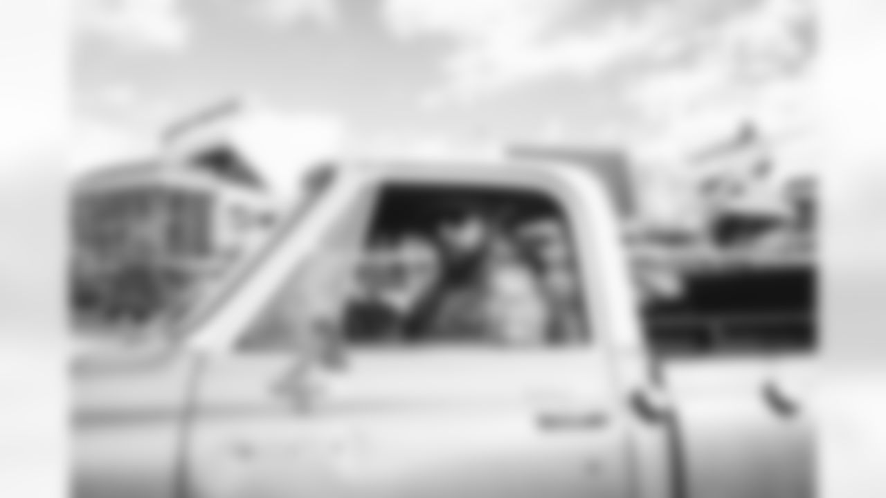 Eric Tomlinson in his vintage truck during player arrivals before the Broncos' Week 7 game against the New York Jets at Empower Field at Mile High in Denver, Colorado on October 23, 2022. (Photo by Ben Swanson)