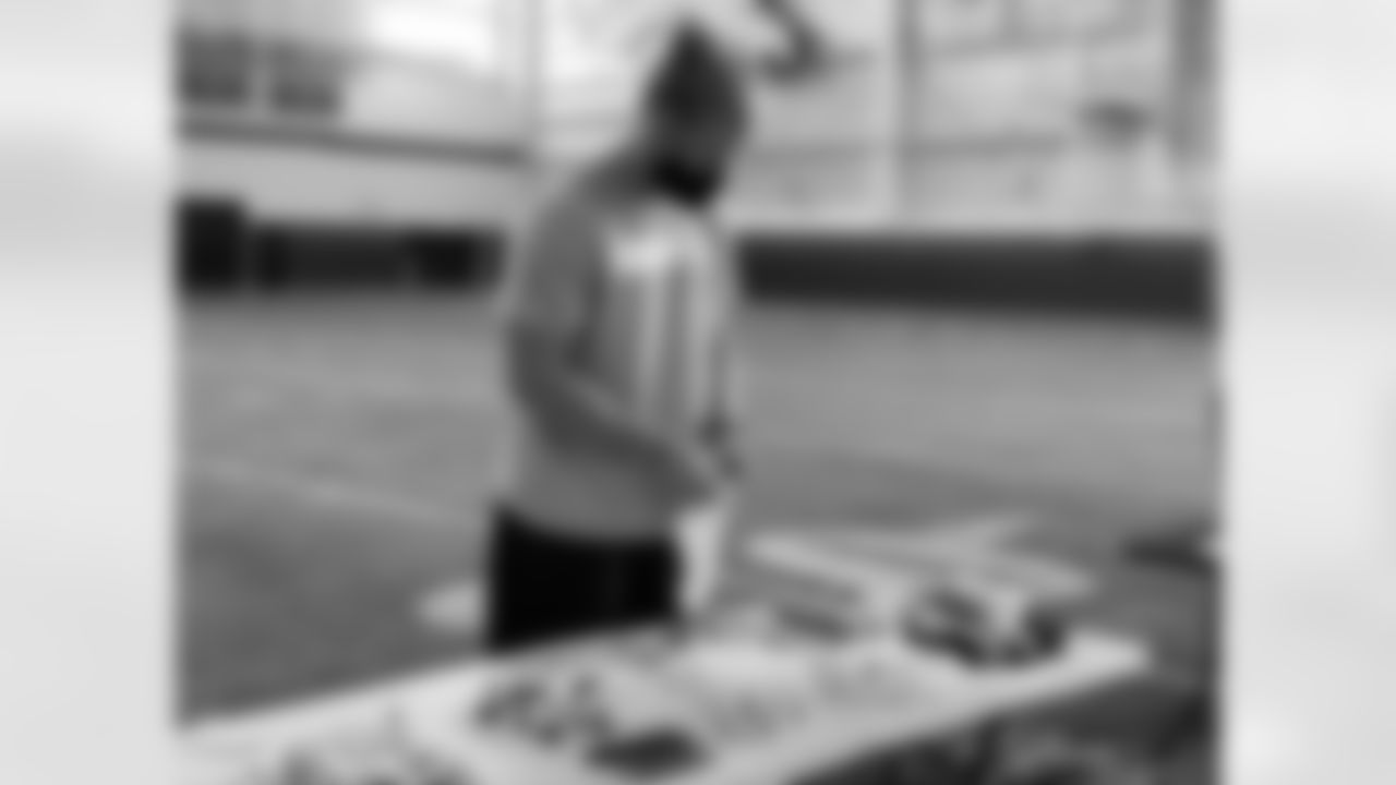 Derrek Tuszka helps put together hygiene kits for the homeless.