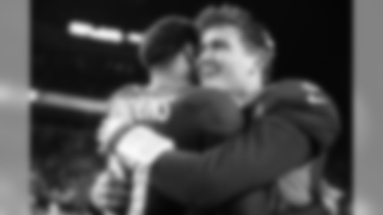 Justin Simmons and Drew Lock celebrate after the Broncos' 23-20 win over the Los Angeles Chargers at Empower Field at Mile High on December 1, 2019. (Photo by Ben Swanson)