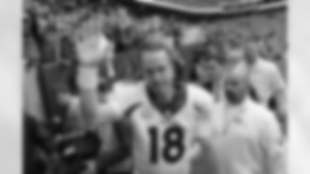 FILE - In this Dec. 22, 2013, file photo, Denver Broncos' Peyton Manning (18) waves to fans following an NFL football game against the Houston Texans in Houston. Manning threw his 51st touchdown pass of the season in the game to set a new NFL record. Manning's next touchdown throw will be his 500th, and if the trend holds true, it will be caught by a tight end, not a wide receiver. Denver plays at home against Arizona on Sunday, Oct. 5, 2014.(AP Photo/David J. Phillip, File)