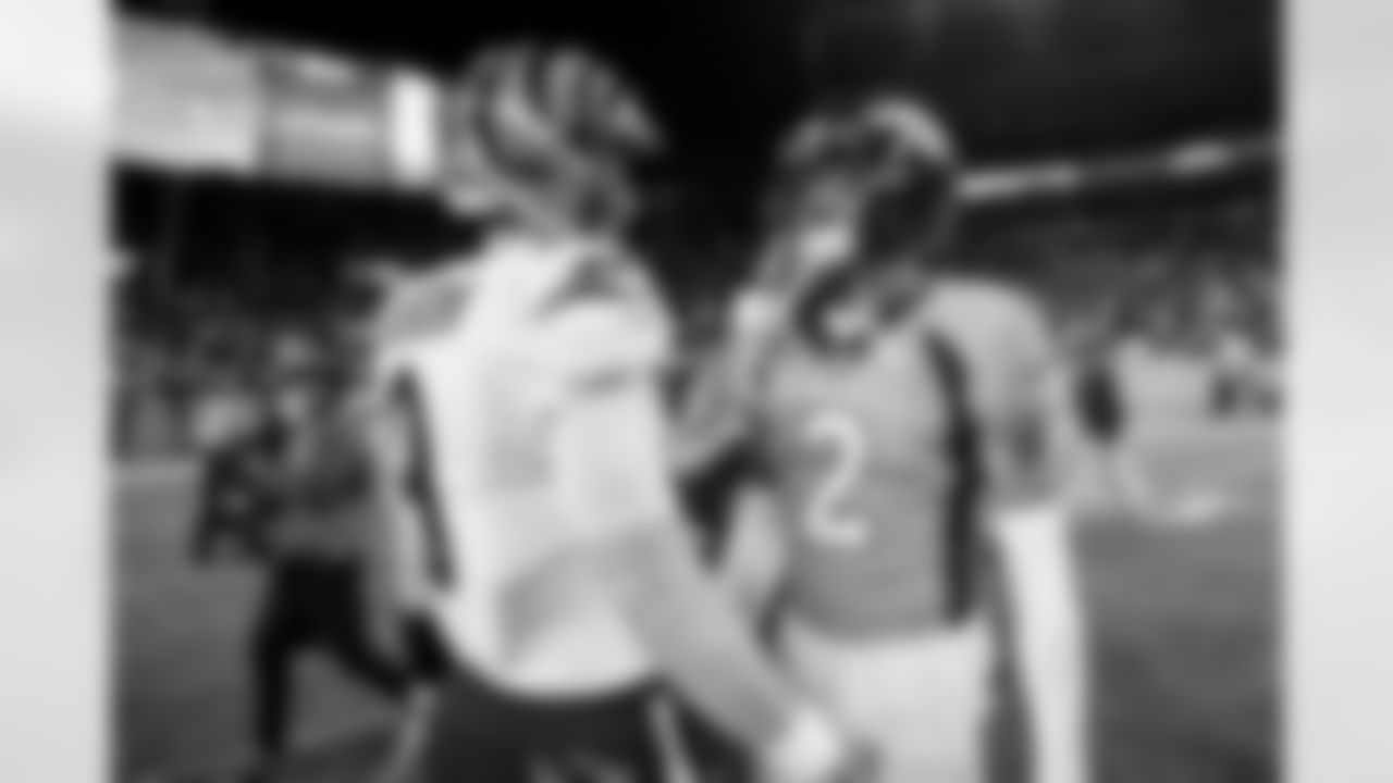 Pat Surtain II and Joe Burrow after the Broncos' Week 15 game against the Cincinnati Bengals at Empower Field at Mile High in Denver, Colorado on December 19, 2021. (Photo by Gabriel Christus)