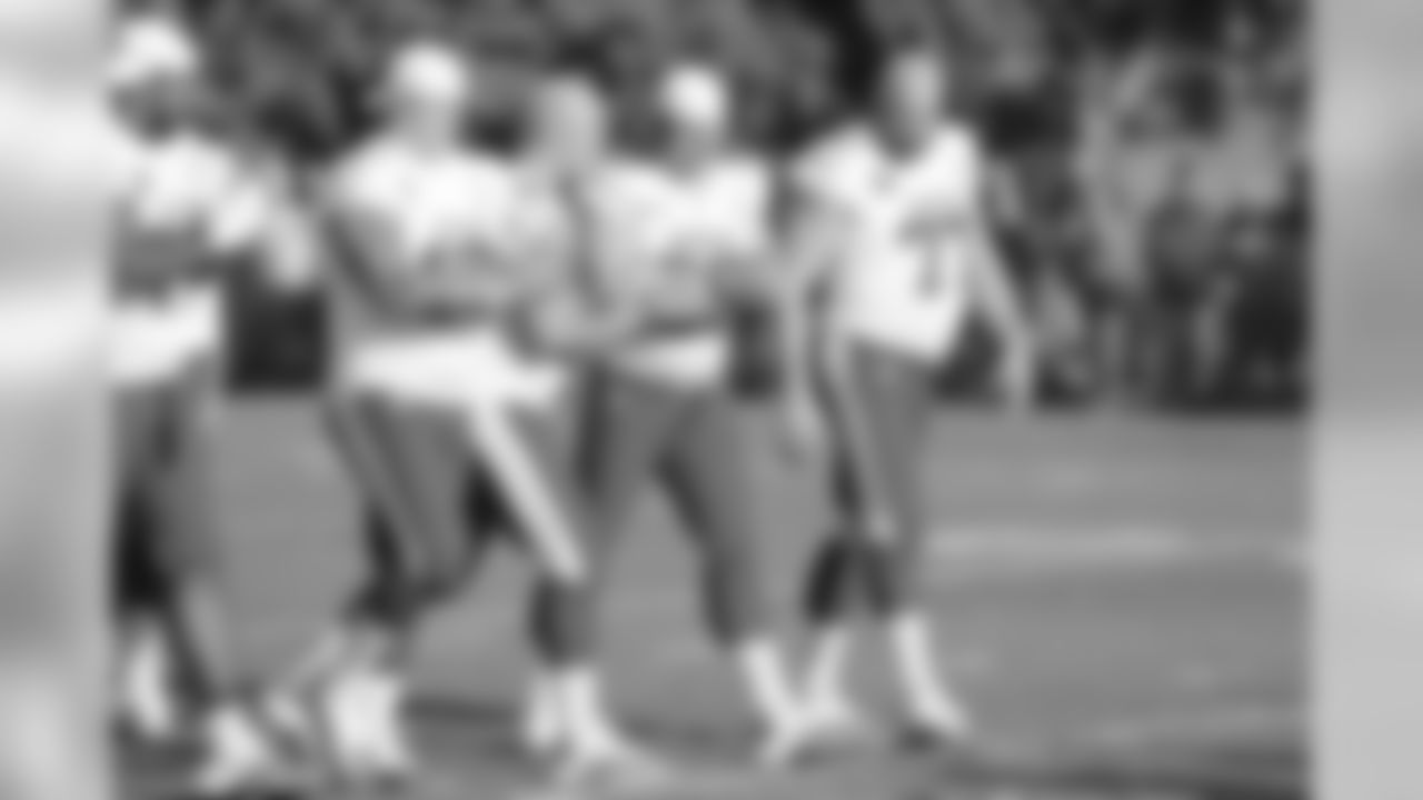 The AFC's offensive line, including Beadles, steps to the line.