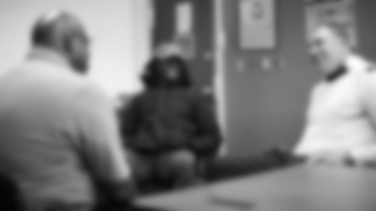 Isaac Yiadom and Garett Bolles talk with technician Tyrone Campbell during an immersive training experience at the Denver Police Academy on October 28, 2019. (Photo by Ben Swanson)