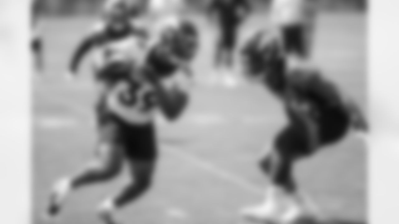 Damarea Crockett and Josh Watson during a training camp practice for early reports (rookies, quarterbacks and select veterans) at UCHealth Training Center on July 25, 2021. (Photo by Ben Swanson)