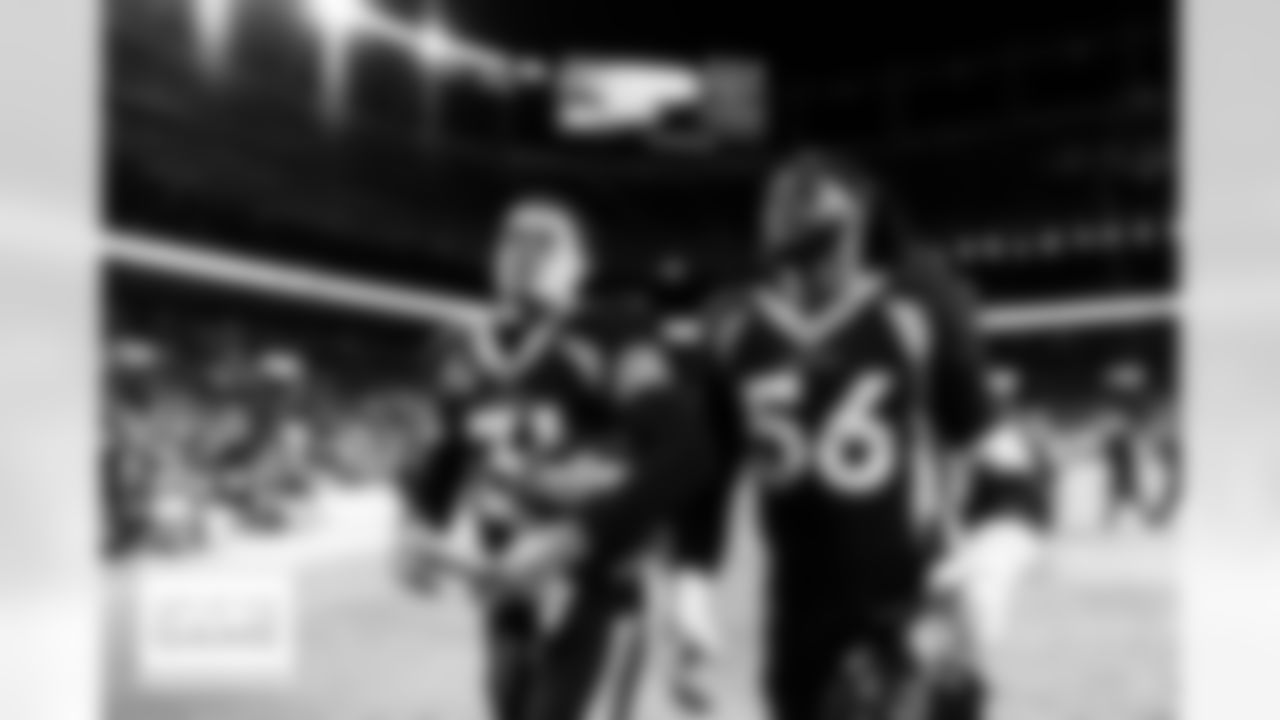 Justin Simmons and Baron Browning after the Broncos' Week 14 game against the Kansas City Chiefs at Empower Field at Mile High in Denver, Colorado on December 11, 2022. (Photo by Ben Swanson)