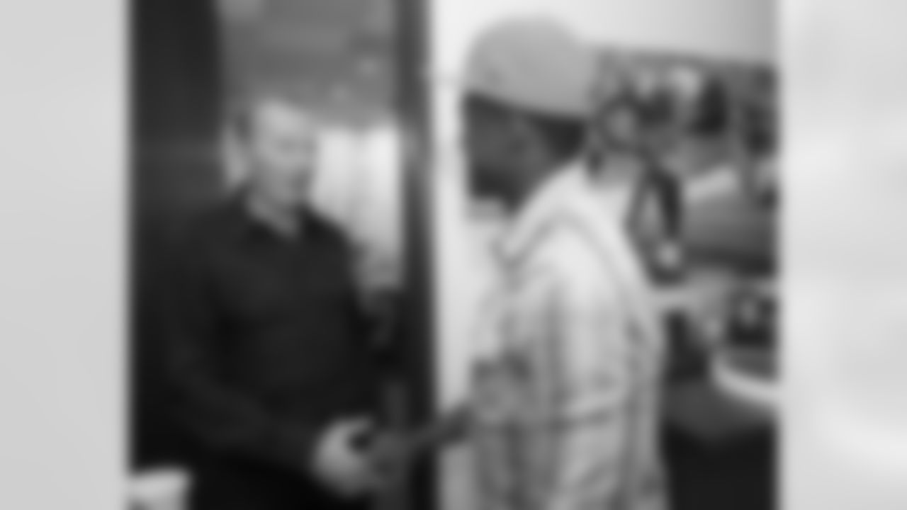 Webster shakes hands with Owner Pat Bowlen.