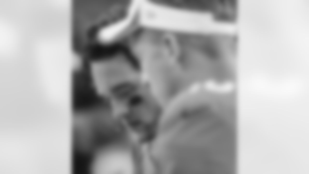 Denver Broncos quarterback Brock Osweiler (17) (background) reviews game photos with Peyton Manning after an offensive series in the 1st quarter of the NFL game against the Arizona Cardinals at Sports Authority Field in Denver, CO
August 29, 2013.