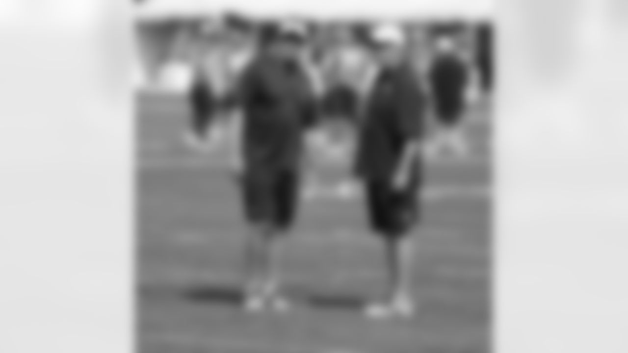 Head Coach John Fox and Defensive Coordinator Jack Del Rio talk during practice.